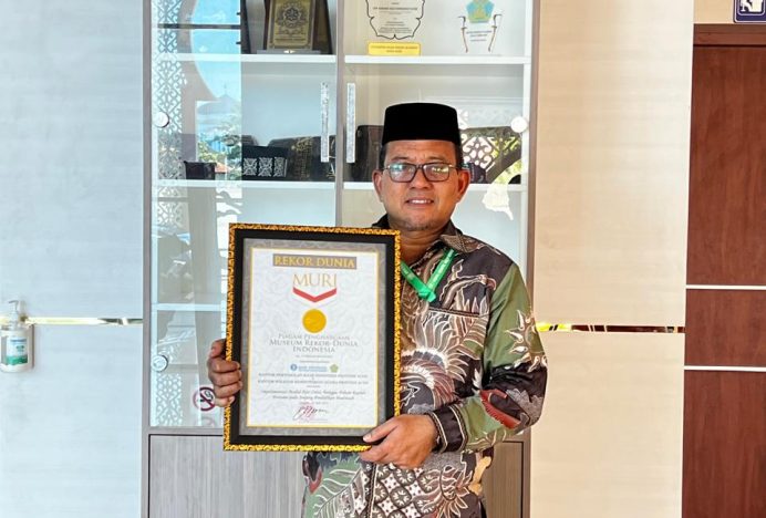 Kanwil Kementerian Agama Aceh dan Bank Indonesia Terima MURI atas Rekor Implementasi Modul CBP Rupiah di Madrasah