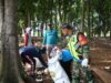 ASN Aceh Besar Gelar Aksi 1 Jam Pungut Sampah di Venue PON XXI Waduk Keliling