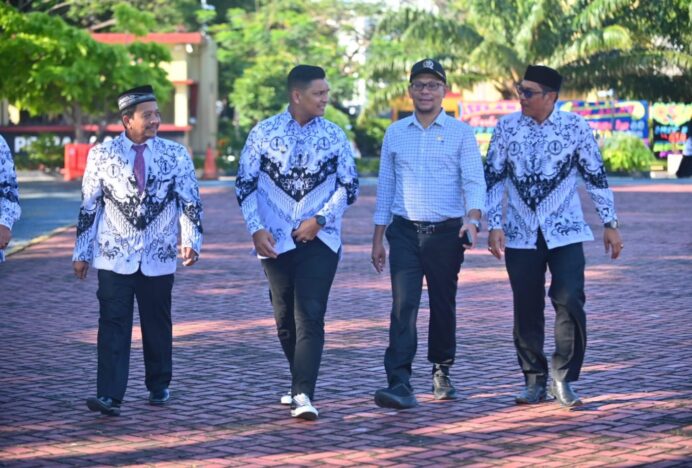 Wakil Ketua DPRK Banda Aceh Musriadi Hadiri Upacara Hari Guru Nasional di Mapolda Aceh
