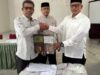 Sambut Idul Fitri, Bupati Bagikan 2.040 Ija Krong ke seluruh Imeum Chik di Aceh Besar